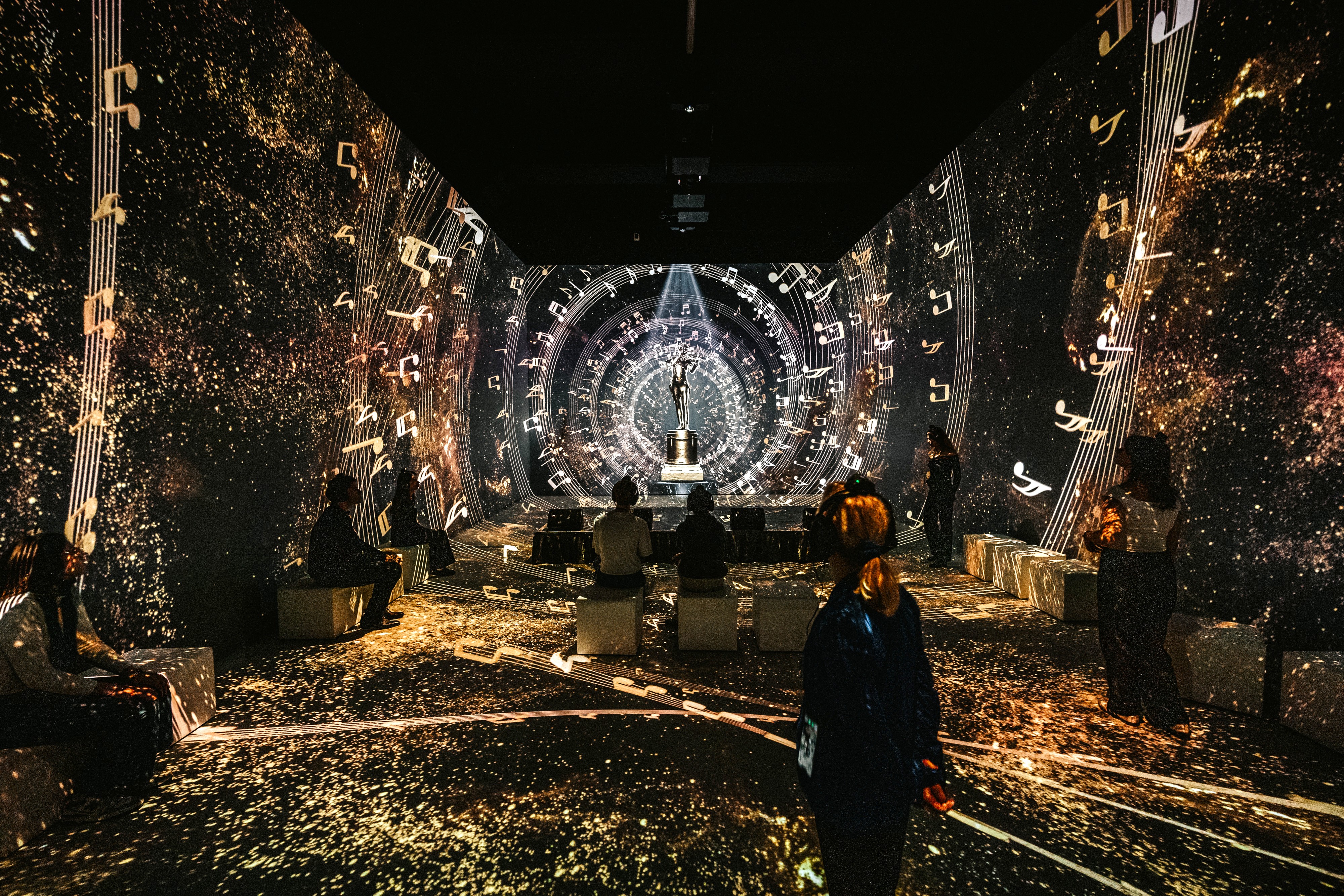 Room at the Johann Strauss Musuem - New Dimensions with installations of light and music, and visitors.