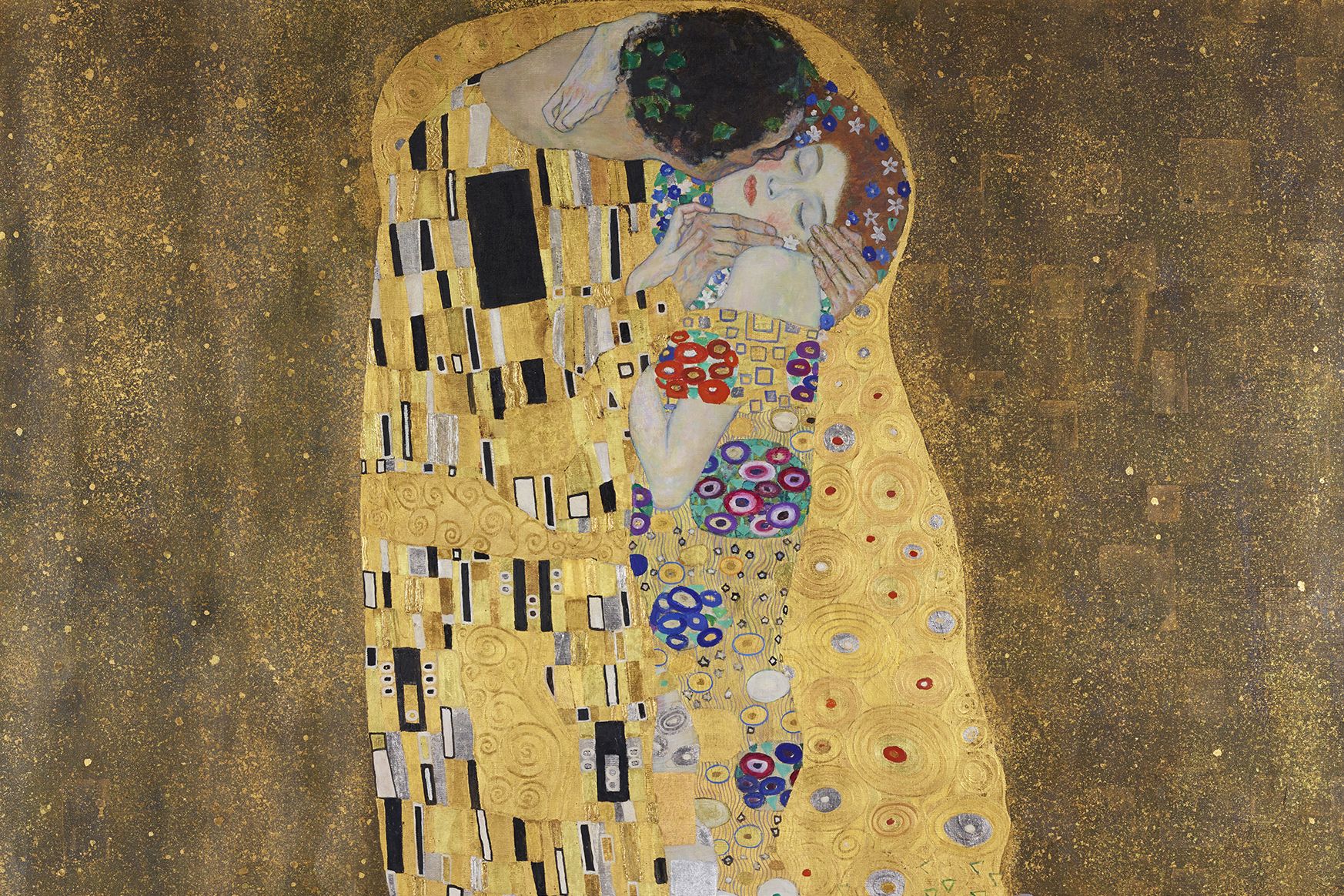 Ein Mann küsst eine Frau, dargestellt in der von Klimt bekannten Ornamentik vorwiegend in Goldfarben